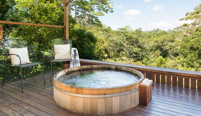 Outside Spa Bath with views of Sunshine Coast rainforest at Spicers luxury cabins