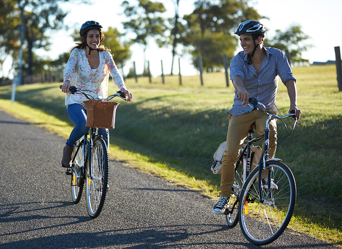 Couple riding bikes in the Hunter Valley